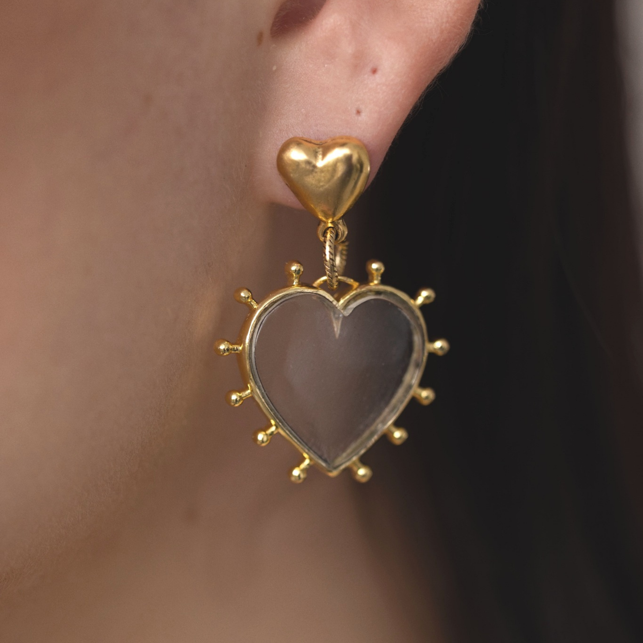 open-hearted-earrings-clear-quartz-on-model-closeup