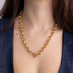 Lanamara Artisan gold necklace worn with front toggle clasp