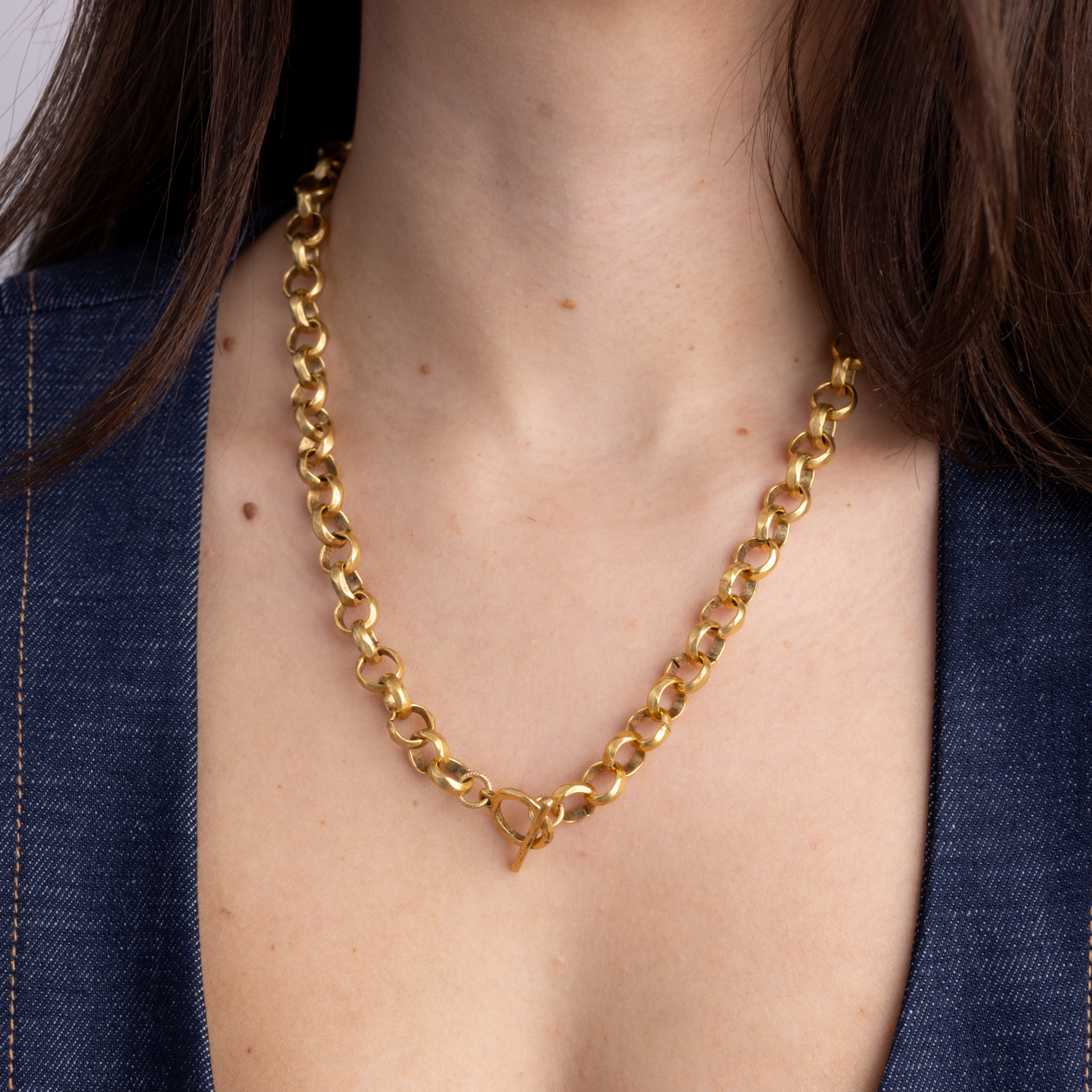 Lanamara Artisan gold necklace worn with front toggle clasp