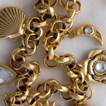 Close-up of Lanamara Artisan hammered gold rolo links with antique finish