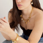 Model wearing the Lanamara Celestial Charm Necklace with matching Celestial earrings and charm bracelet