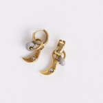 Lanamara Celestial Huggies flat lay — gold crescent moon drop with removable pavé CZ charm