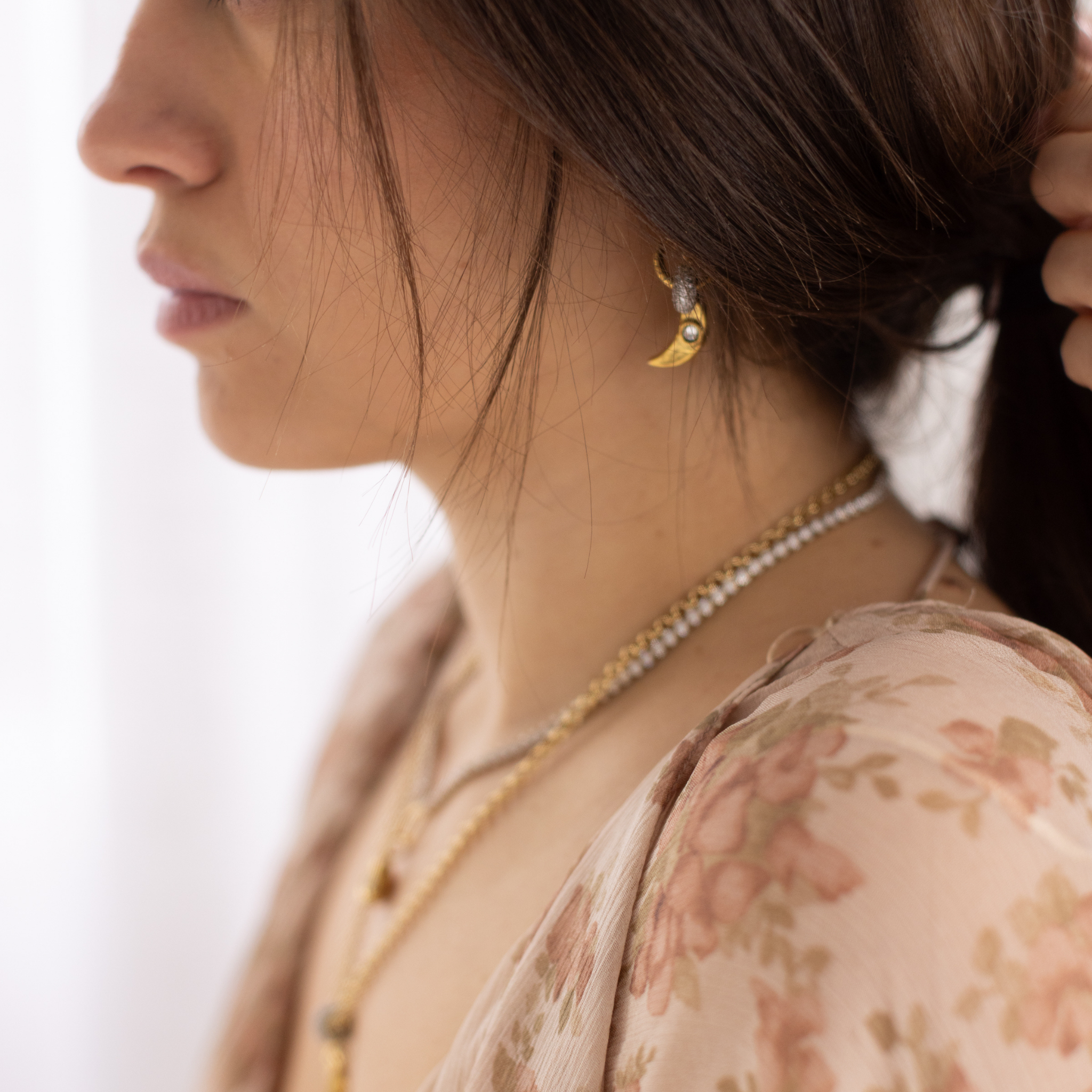 Lanamara Celestial Huggie crescent moon drop earring worn, side view