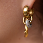 Close-up of Lanamara Celestial Huggie earring with pavé CZ charm and crescent moon drop