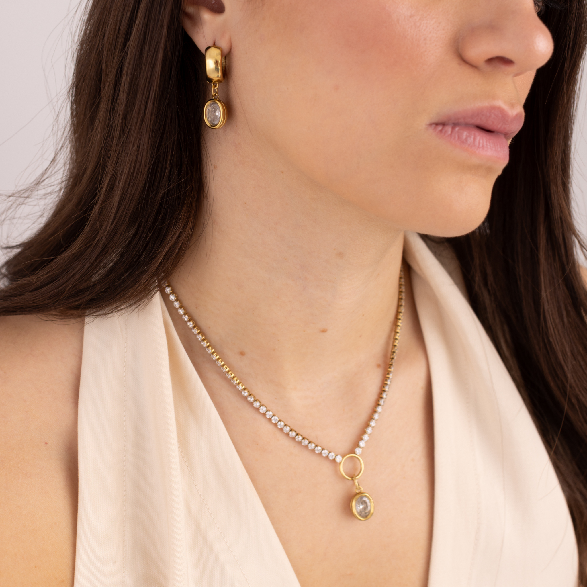 Model wearing Lanamara Clarity Tennis Necklace with bezel-set oval CZ pendant