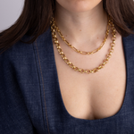 Model wearing Lanamara Heirloom signature gold chain necklace, layered