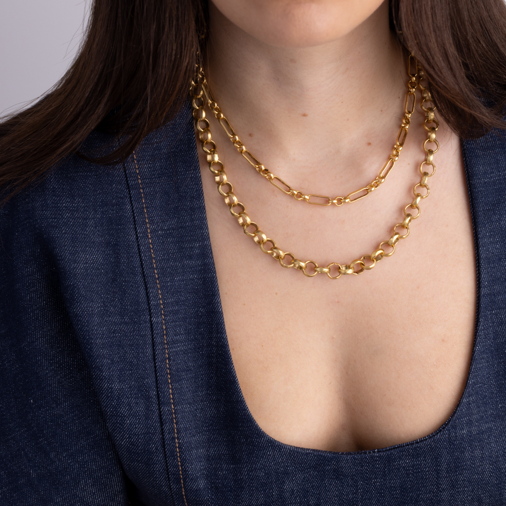 Model wearing Lanamara Heirloom signature gold chain necklace, layered