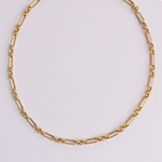 Lanamara Heirloom mixed vintage-link gold chain necklace, flat lay on white