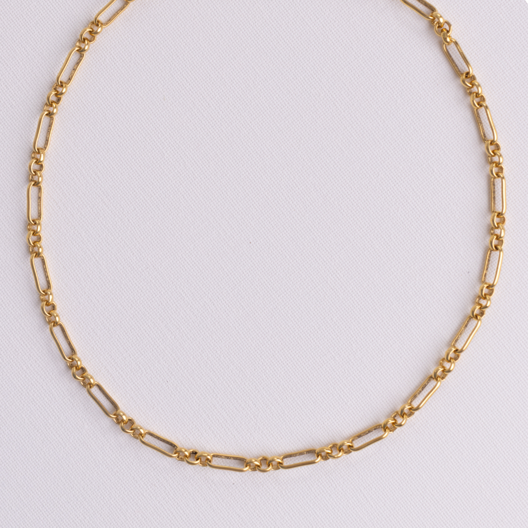 Lanamara Heirloom mixed vintage-link gold chain necklace, flat lay on white