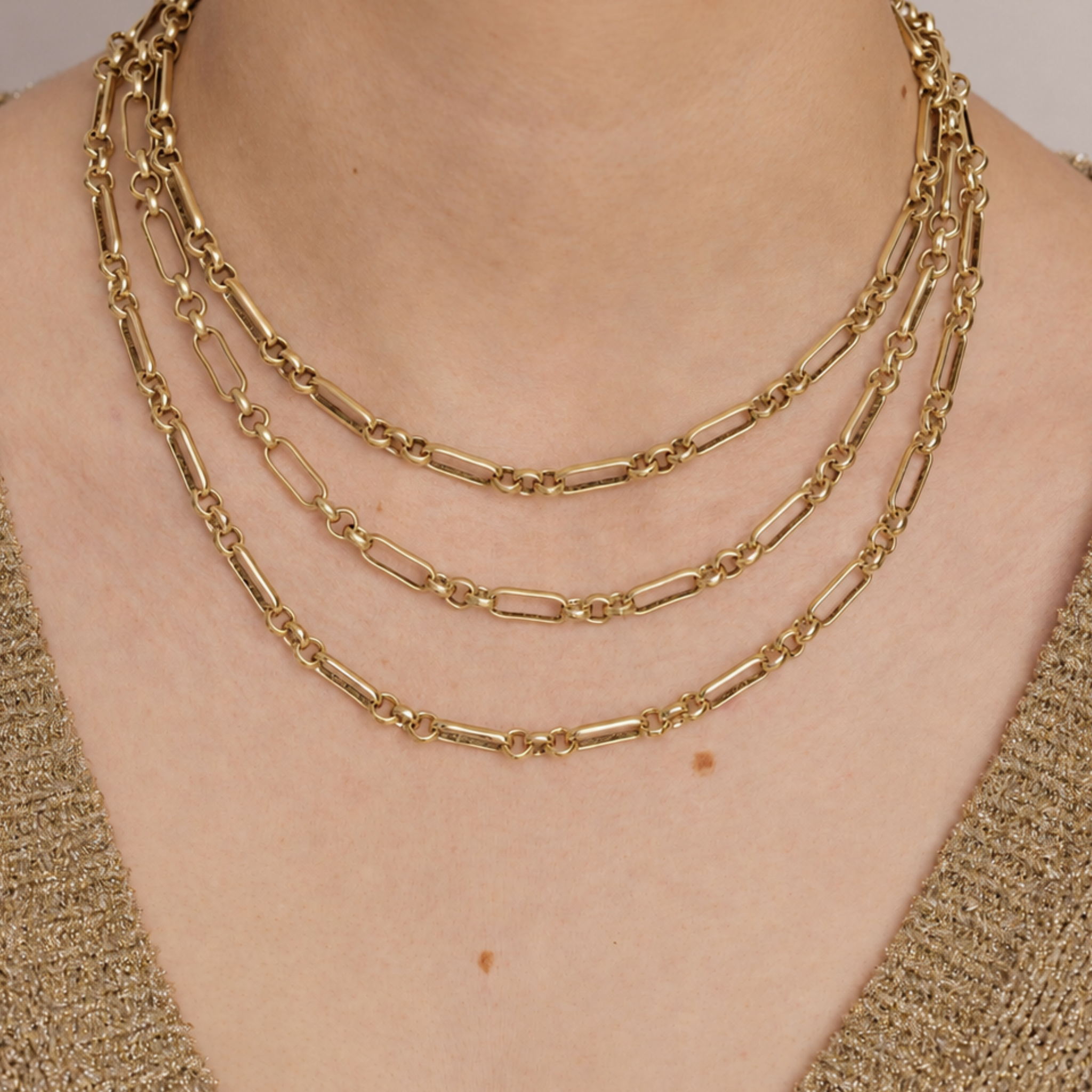 Lanamara Heirloom gold necklace shown layered in three lengths