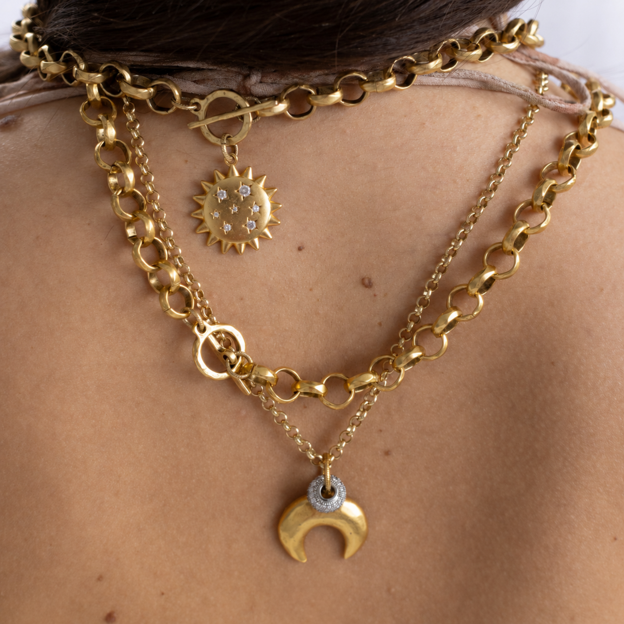 Lanamara Intuition Sunstar necklace layered with the crescent moon necklace