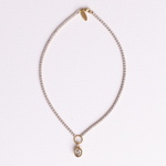 Lanamara Clarity Tennis Necklace – Oval, gold CZ chain with bezel-set oval pendant, flat lay on white