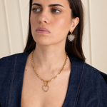Model wearing Lanamara Open Hearted heart earrings and open heart necklace, Celestial campaign portrait