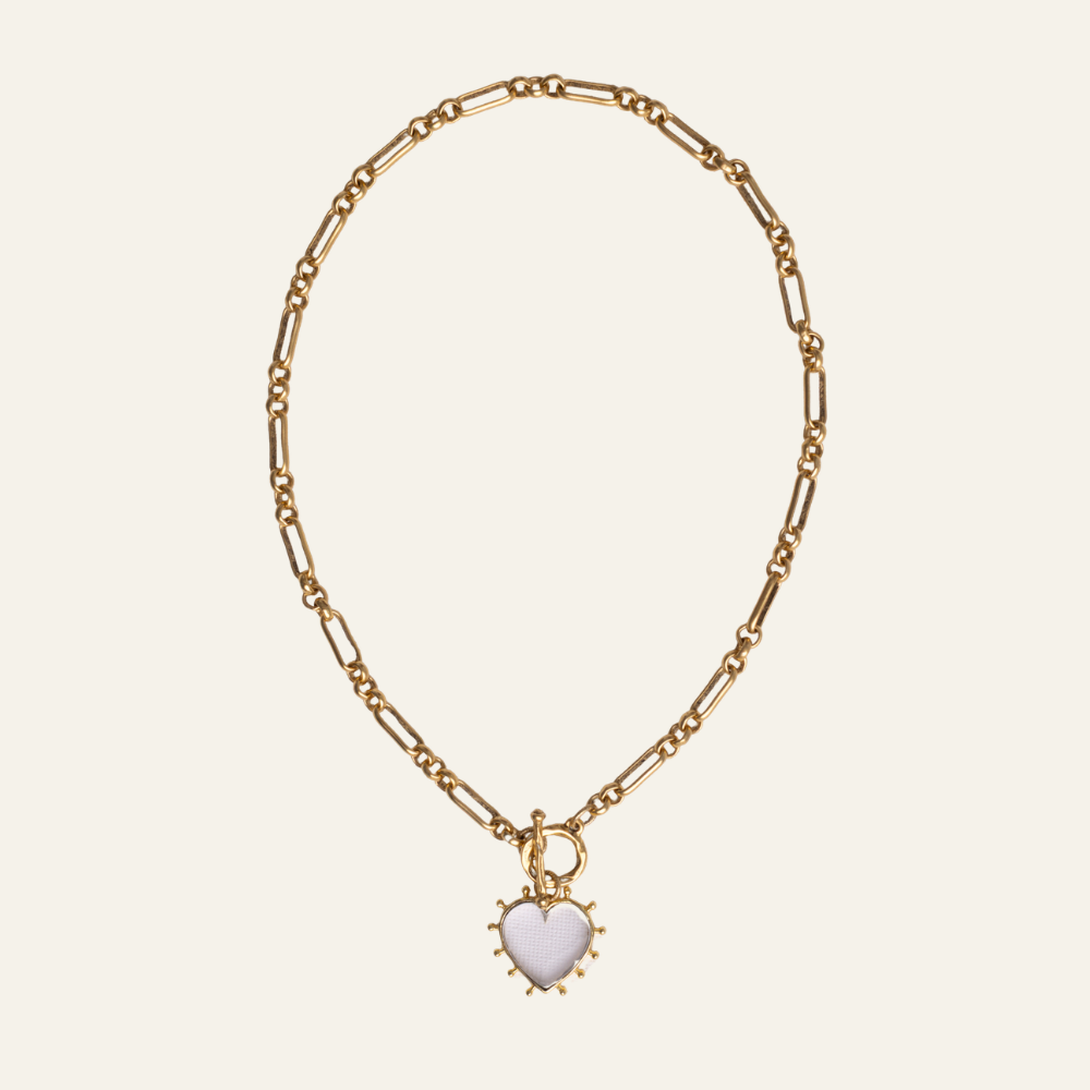 Lanamara Open Hearted Necklace — clear quartz heart pendant on gold heirloom chain with toggle