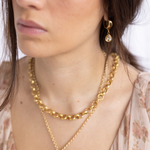 Lanamara Artisan gold necklace worn with Clarity Vintage Huggie earrings with pear pendant