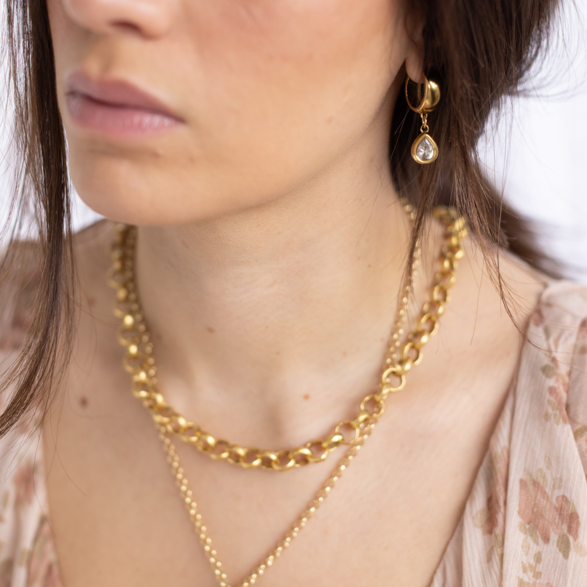 Lanamara Artisan gold necklace worn with Clarity Vintage Huggie earrings with pear pendant